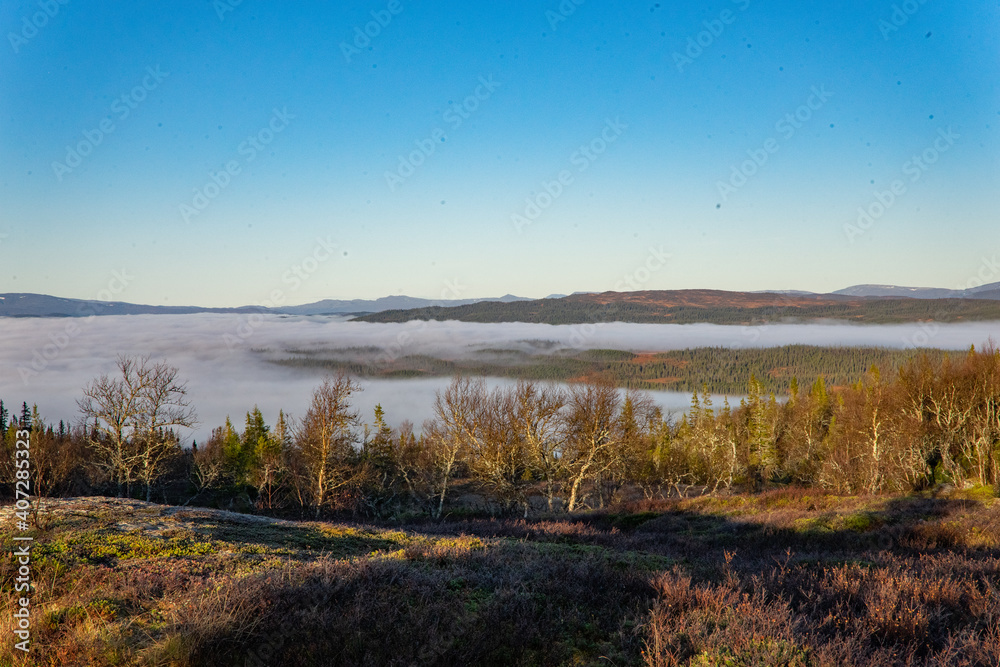 Fog over a valley of Lierne national park in Norway