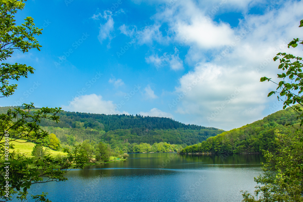 Rursee at Eifel National Park, Germany. Scenic view of lake Rursee and surrounded green hills in North Rhine-Westphalia Rursee at Eifel National Park, Germany. Scenic view of lake Rursee and surrounded green hills in North Rhine-Westphalia