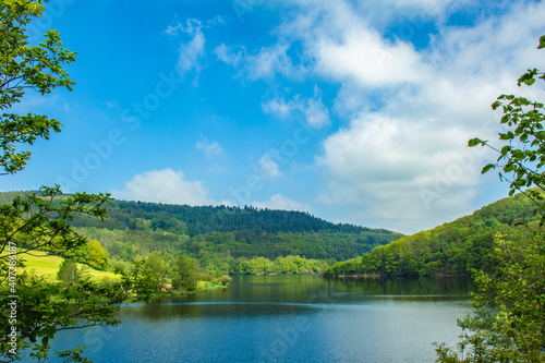 Rursee at Eifel National Park  Germany. Scenic view of lake Rursee and surrounded green hills in North Rhine-Westphalia