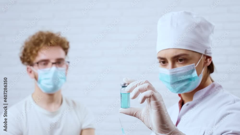 Young man preparing for injection vaccine covid-2019 in clinic. Young man preparing for injection vaccine covid-2019 in clinic.