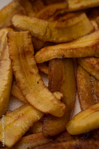 Sliced fried plantains to make a typical Venezuelan dish with arepas and shredded meat, Pabellón Criollo