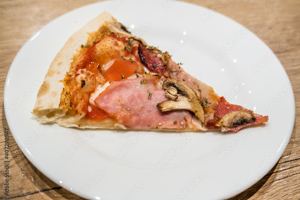 Delicious classic italian Pizza Carbonara with ham, tomatoes, mushrooms and cheese Delicious classic italian Pizza Carbonara with ham, tomatoes, mushrooms and cheese