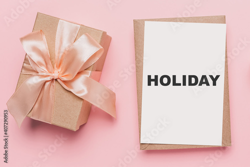 Gifts with note letter on isolated pink background, love and valentine concept with text holiday