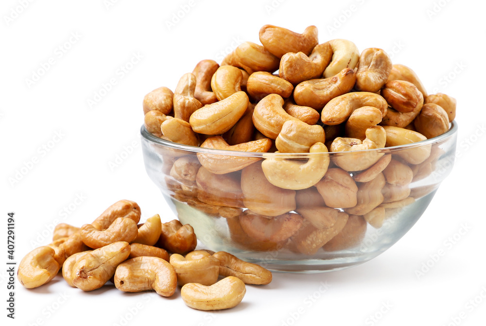 Roasted nuts in a glass plate on a white background. Isolated Roasted nuts in a glass plate on a white background. Isolated