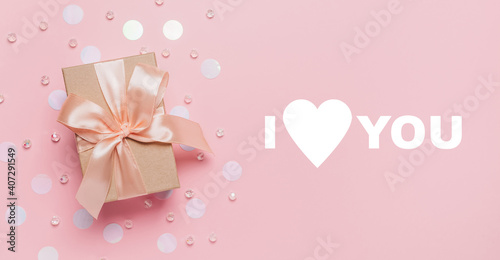 Gifts on pink background, love and valentine concept with text I love you © Daria Lukoiko