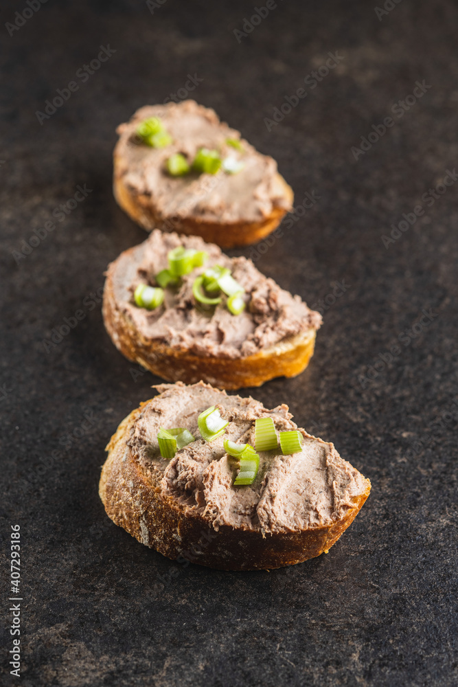Liver pate on sliced baguette. Liver pate on sliced baguette.