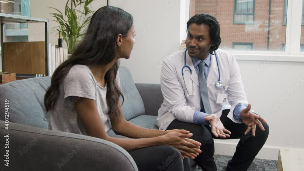 Doctor Explaining Difficult News to Young Woman Doctor Explaining Difficult News to Young Woman