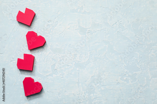 Red hearts on color background