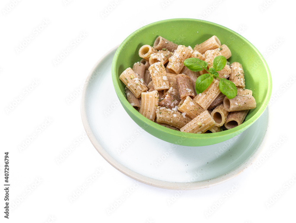 Macaroni with dairy sauce in bowl. Italian cuisine