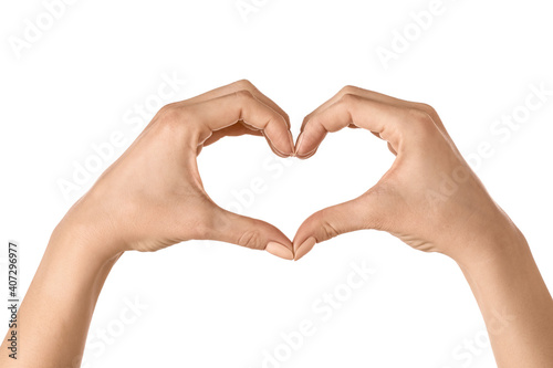 Hands making heart on white background