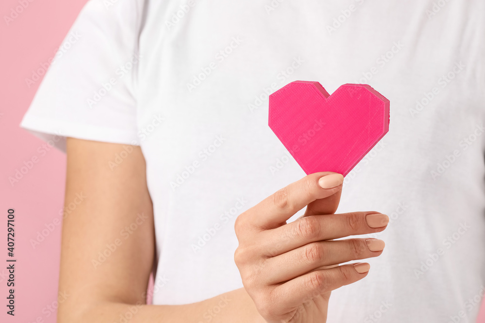 Woman with red heart, closeup