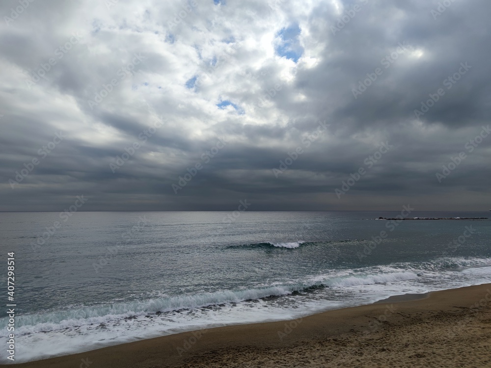 nostalgic,seascape,shore, riverside of a spanish mediterranean beach with clouds at autumn / winter
