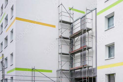 renovation of the facade of an apartment house using scaffolding photo