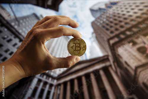 Bitcoin gold coin in hand. Bitcoin cryptocurrency. Business concept.