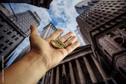 Cryptocurrency in hand. Bitcoin in hand. Submit cryptocurrency.