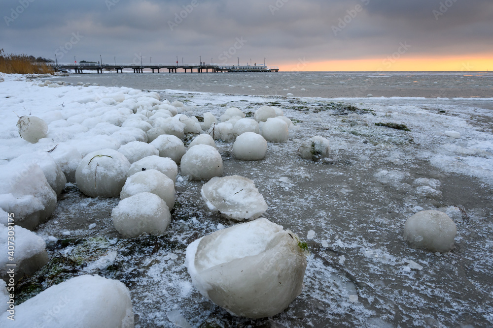 Natural ice balls on the beach in Jastarnia during winter. Hel Peninsula, Poland Natural ice balls on the beach in Jastarnia during winter. Hel Peninsula, Poland