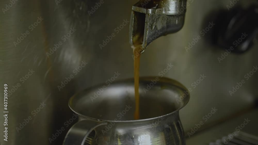 Close-up, Slow Motion, Coffee Poured From Holder to Metal Pitcher Close-up, Slow Motion, Coffee Poured From Holder to Metal Pitcher