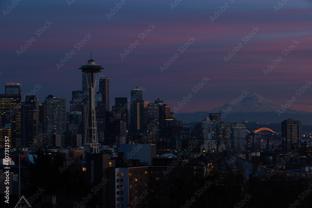 The city of Seattle, Washington at night. Most buildings are dark.