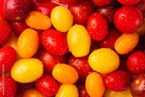 Assorted Cherry Tomatoes close up with water spray