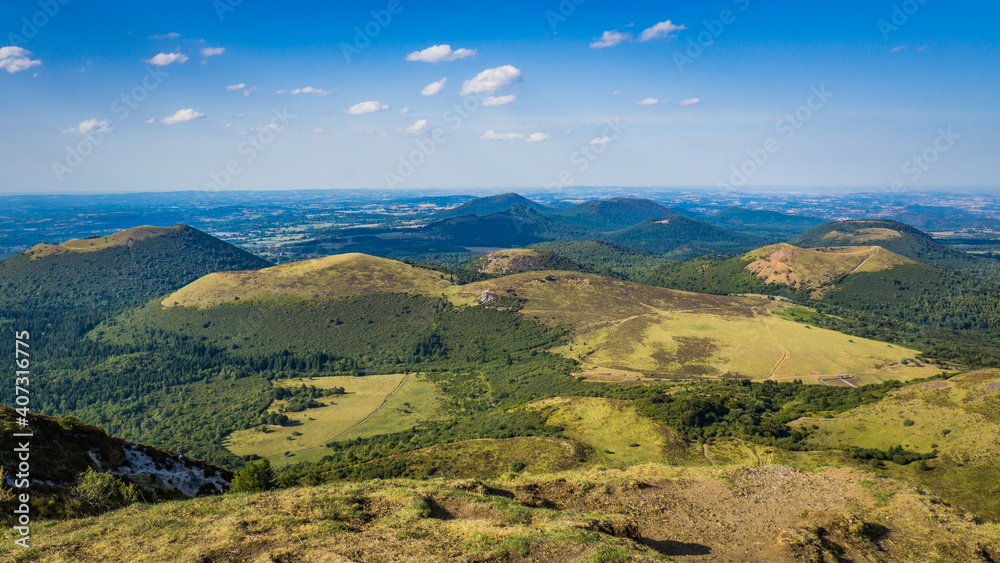 View on the Chaine des Puys volcanoes range from the top of the Puy de Dome, the most famous volcano this range, in Auvergne, France
