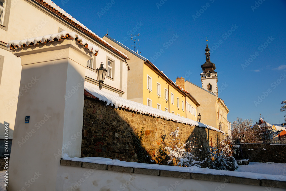 Gothic Fortress walls in winter day, tower of church of Nativity of the Blessed Virgin Mary, Medieval fortifications, architectural monument, Pisek, Southern Bohemia, Czech Republic