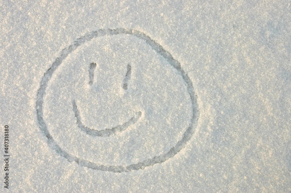 a smile. in the photo a smile painted on white snow in winter a smile. in the photo a smile painted on white snow in winter