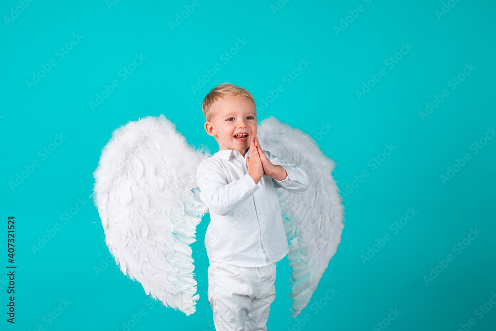 Studio shot of little boy child as angel.