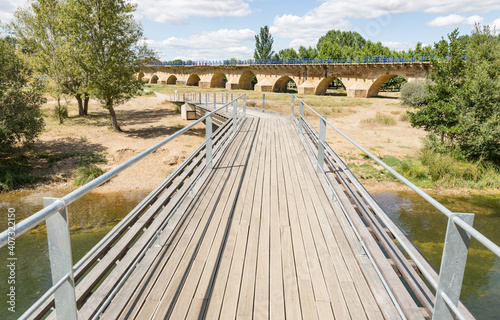 walkway bridge over Porma river in Puente Villarente
(Municipality of Villaturiel), province of Leon, Castile and Leon, Spain photo