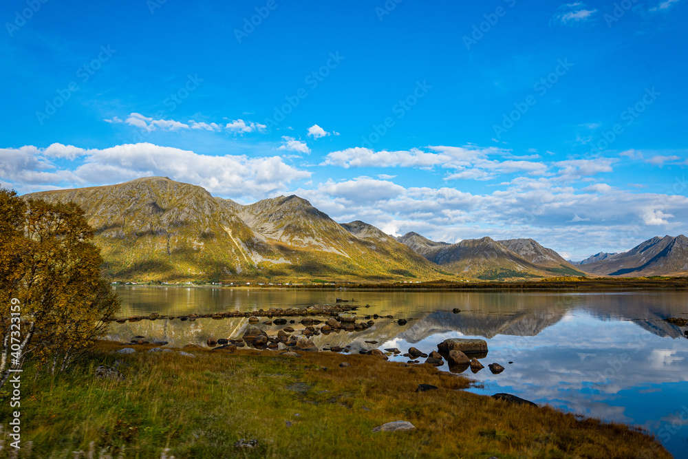 Reflections from mountains in a fjord in Norway