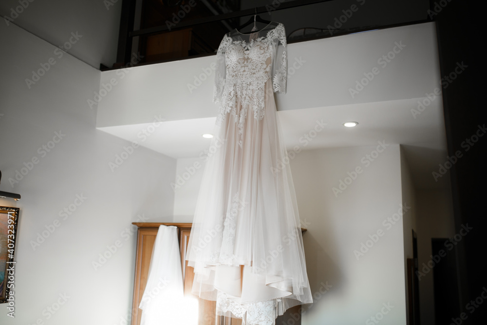 The wedding dress is hanging in the house. Wedding morning. The wedding dress is hanging in the house. Wedding morning.