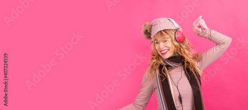 adult woman with headphones dancing on isolated