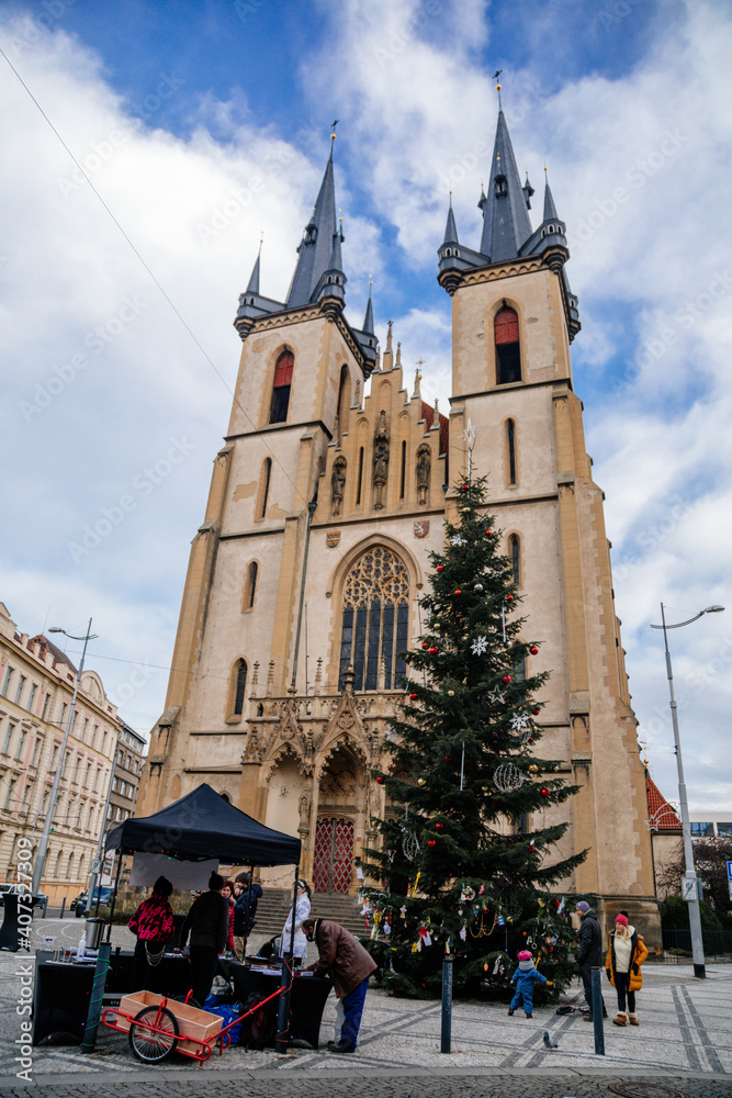 Christmas tree near church of St. Anthony of Padua in Holesovice built, Kostel Sv. Antonina Paduanskeho, historical sightseeing gothic cathedral, Prague, Czech Republic