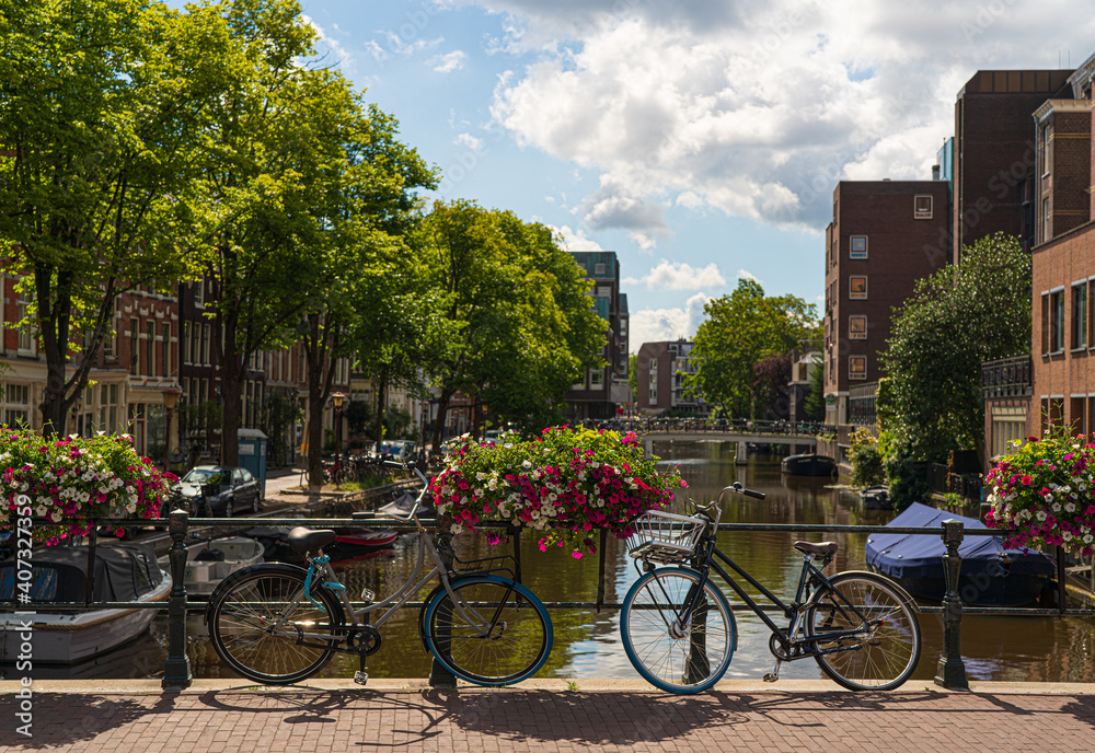 bikes on a canalbridge in amsterdam in summer