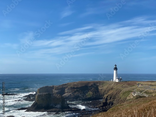 lighthouse on the coast, wide shot 