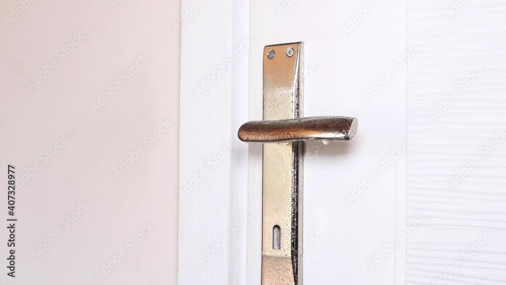 Close up view of hand using antibacterial wet wipe for disinfecting home room door link. High quality 4k footage Close up view of hand using antibacterial wet wipe for disinfecting home room door link. High quality 4k footage