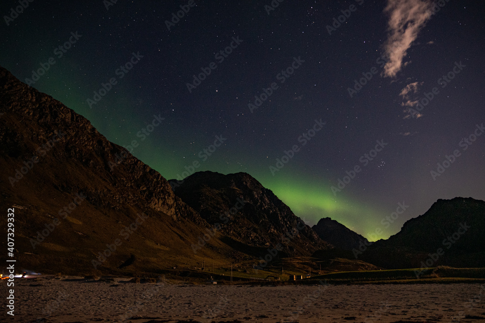 Northern lights with moon shine at Haukland beach in north Norway