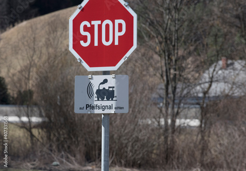 ungated railroad crossing in train traffic photo