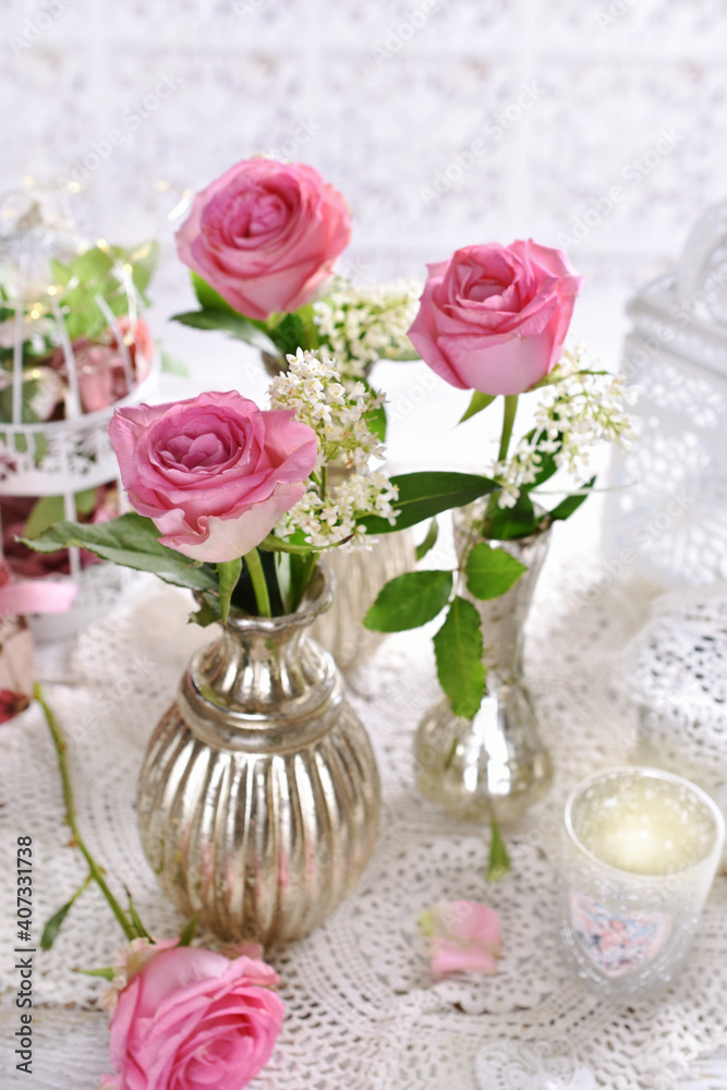 beautiful arrangement with single pink roses in silver vases beautiful arrangement with single pink roses in silver vases