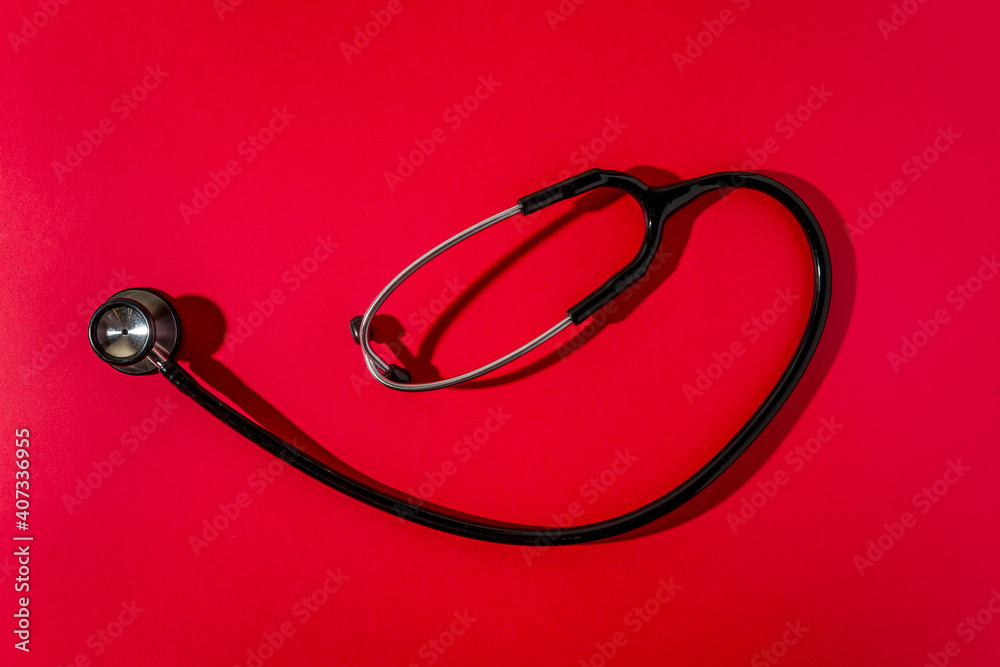 Stethoscope on a red background