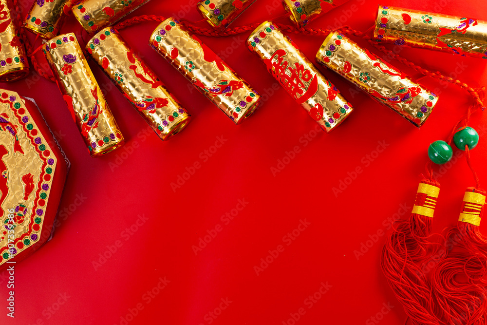 Chinese new year festival with home decoration and golden firecracker on red blackground