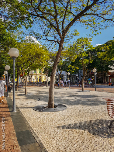 Square, green trees and sun. Itu, Brasil