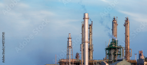 Canvas-taulu iron pipes of a chemical plant for the production of environmentally hazardous industrial products against the background of a blue sky outdoor, nobody