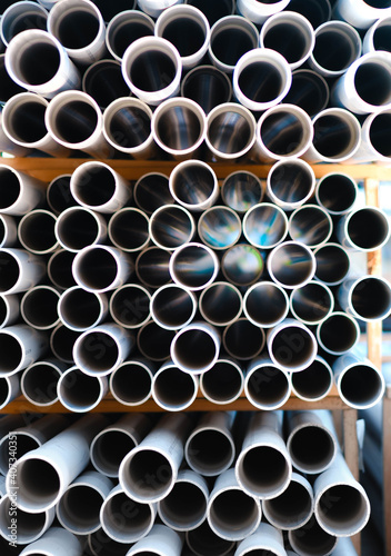 Stack of pipes making tryphphobia pattern of many tiny holes