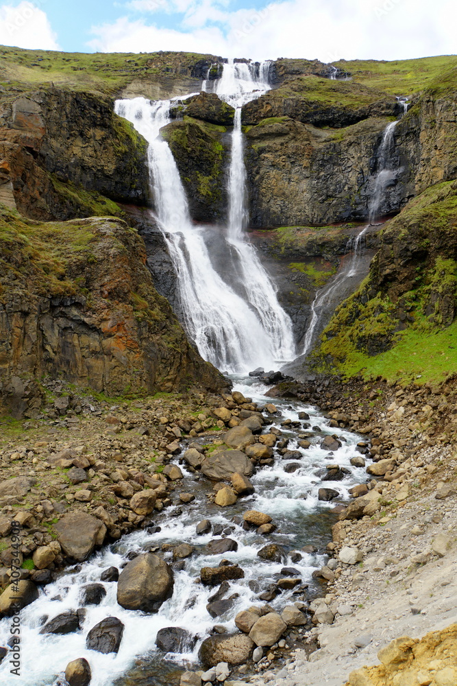 Obraz premium The view of the Rjukandafoss, a beautiful waterfall off Route 1 near Jokuldalur, Iceland during the summer
