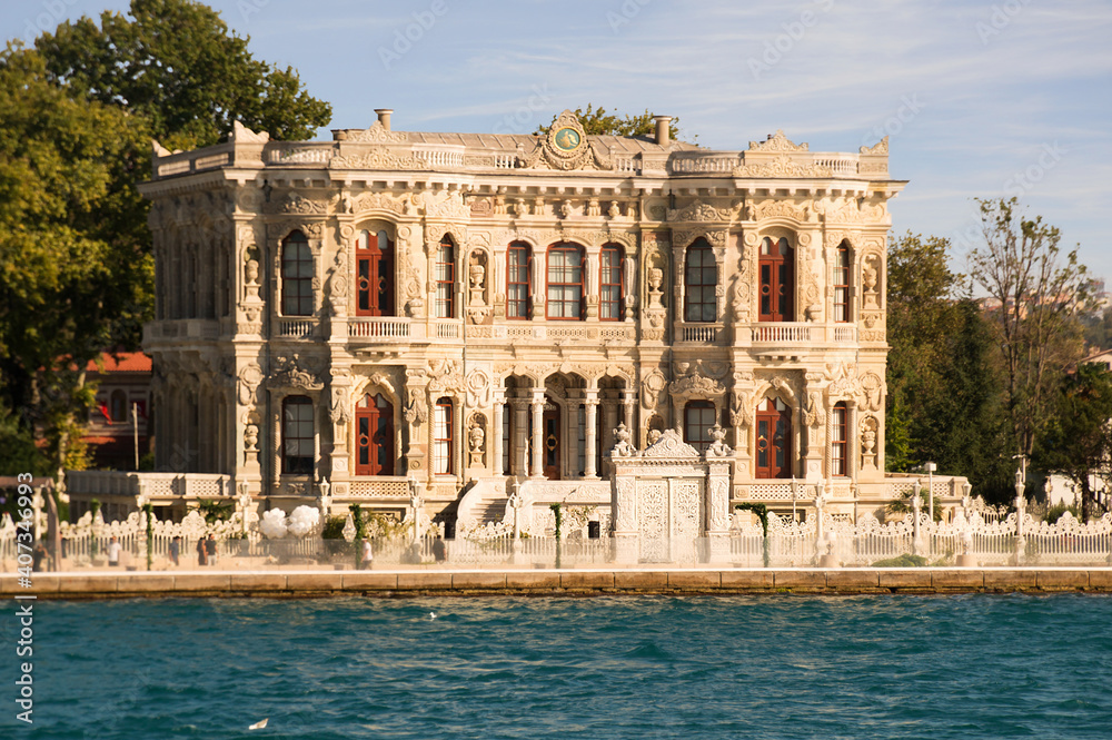 View from the waters of Bosporus Strait on Kucuksu Palace, a historic Neo-Baroque waterfront palace built as a summer residence for Ottoman sultans in Beykoz district of Istanbul