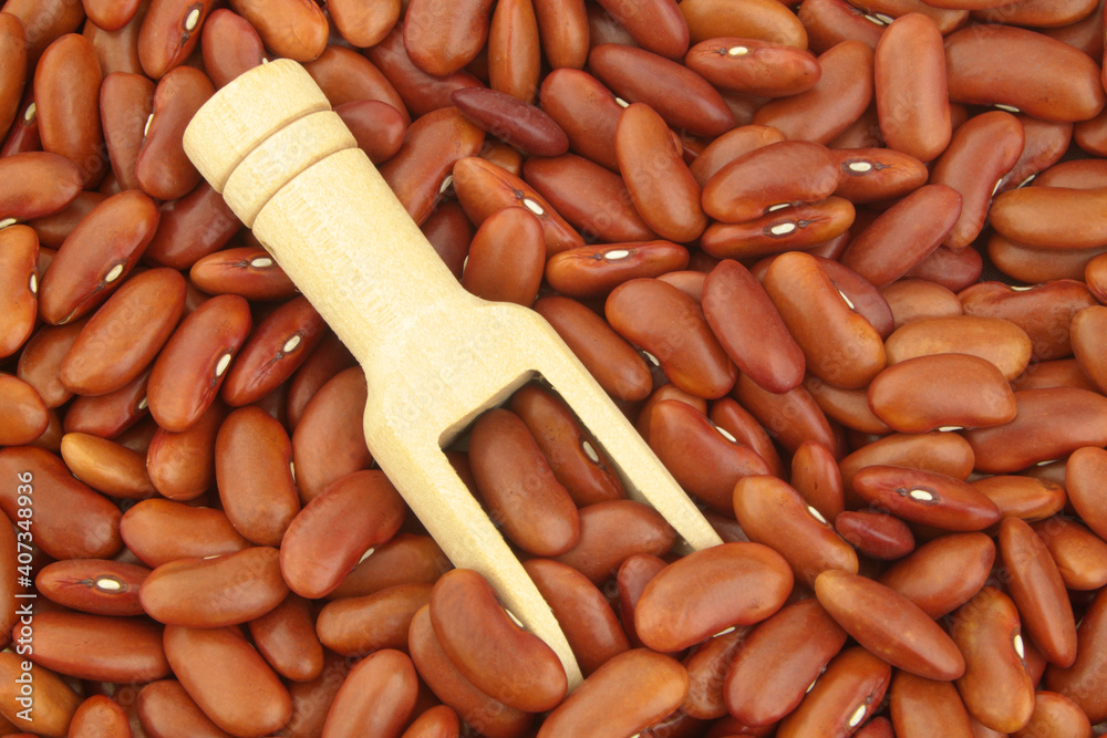 Red kidney beans with wooden scoop Red kidney beans with wooden scoop
