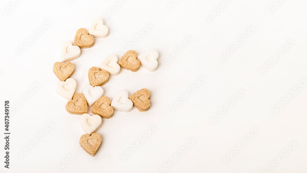 Sugar in the form of hearts on a white background Sugar in the form of hearts on a white background