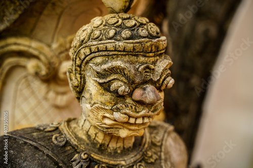 Old Buddha demon statue in close up