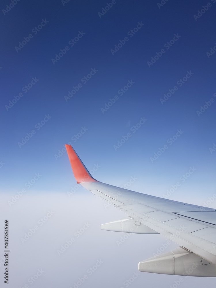 Fototapeta premium Wing aircraft in the blue sky