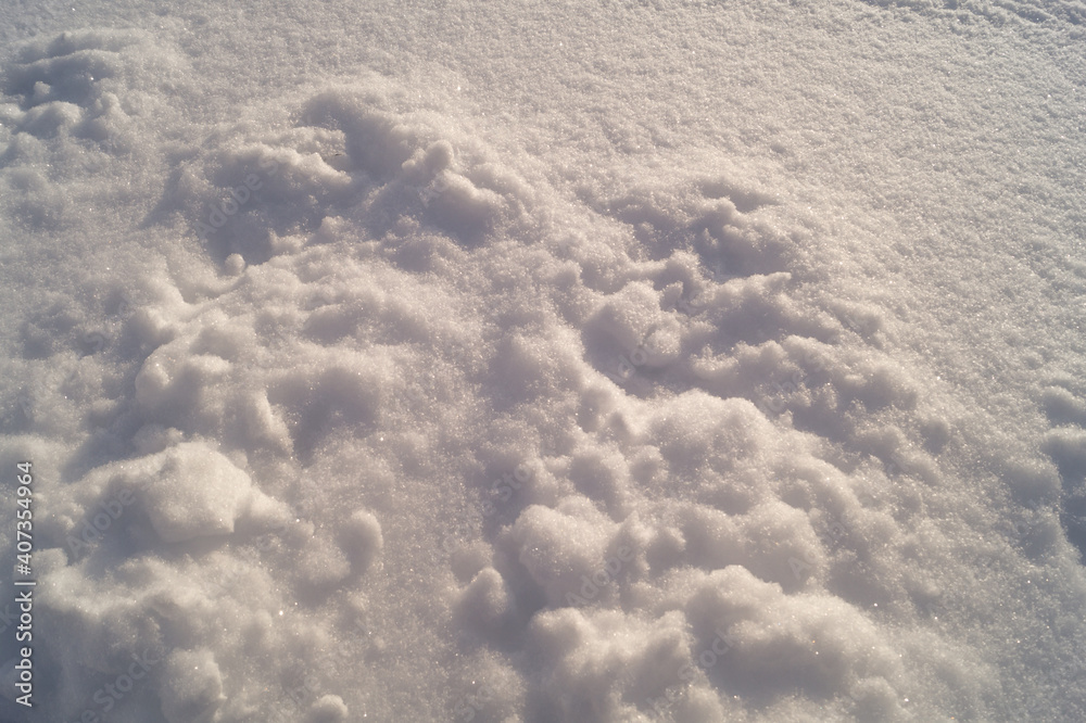 White snow on the river bank, unusual small drifts. White snow on the river bank, unusual small drifts.